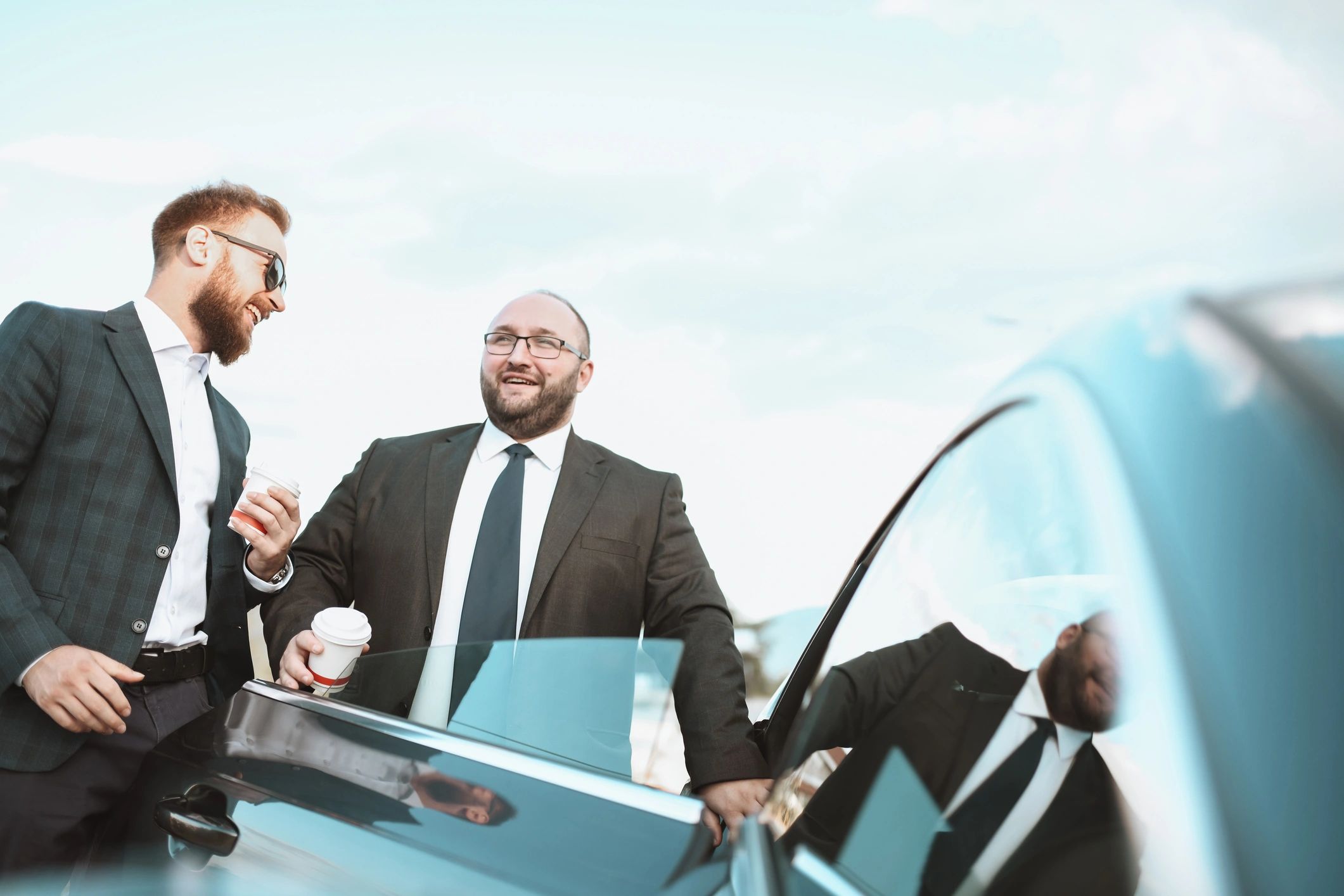 Business traveler with professional driver during a corporate trip